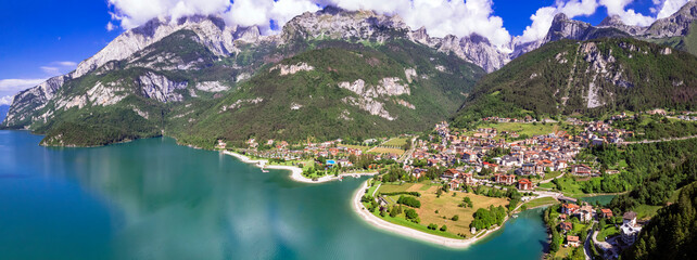 Most scenic mountain lakes in northern Italy - beautiful Molveno in Trento, Trentino Alto Adige region. panoramic aerial drone high angle view.. - 744028805