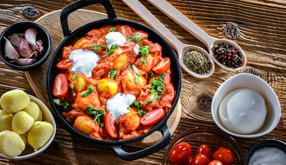 Creamy tomato gnocchi with burrata, basil and garlic