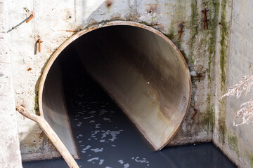 A large diameter sewer pipe in which muddy slurry flows