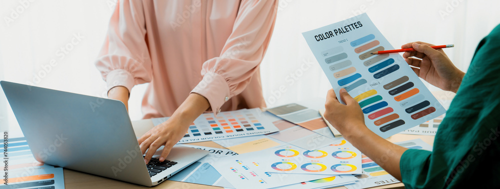Poster creative graphic design presents selective color while manager using laptop comparing suitable color