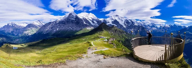 Fotobehang Swiss nature scenery. Scenic snowy Alps mountains Beauty in nature. Switzerland landscape. View of Mannlichen mountain and famous hiking route "Royal road". © Freesurf
