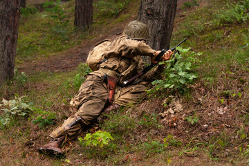 Historical reconstruction. An American paratroopers soldier from the World War II  fighting in the...