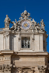 Fototapeta na wymiar Facade of Saint Peter's Basilica with decorative clock on a top, Vatican, Rome, Italy