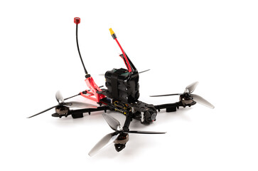 Photo of a do it yourself quadcopter fpv on a white background. Modern Combat FPV drone on the radio control. low cost loitering munition for modern war 