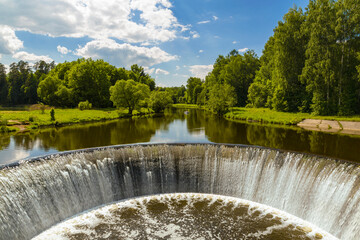 The dam of old power station on the Lama River. Yaropolets, Moscow region, Russia - 744095206