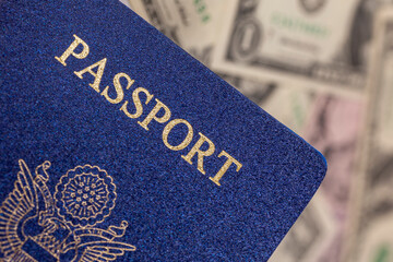 United States passport with dollar bills