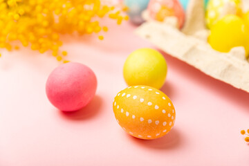 Easter eggs on a bright pink background. Easter celebration concept. Colorful easter handmade decorated Easter eggs. Place for text. Copy space.