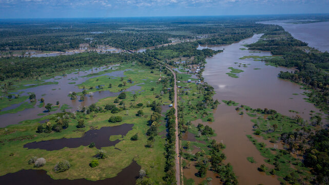 Aerial view of the BR 319 highway linking Manaus and Porto Velho in the Brazilian Amazon. The beginning of the route in Careiro da V&aacute;rzea is surrounded by wetlands and rainforest. Amazonas, Brazil