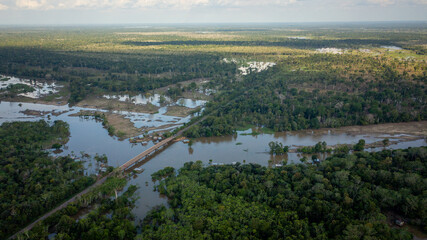 Aerial view of the BR 319 highway linking Manaus and Porto Velho in the Brazilian Amazon. The beginning of the route in Careiro da Várzea is surrounded by wetlands and rainforest. Amazonas, Brazil