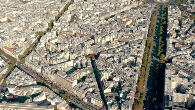 PARIS, FRANCE - MAY 30, 2023: Panorama aerial view of Paris city historical center. Top drone view of old and modern famous touristic landmarks. Colorful sky at at sunny day.