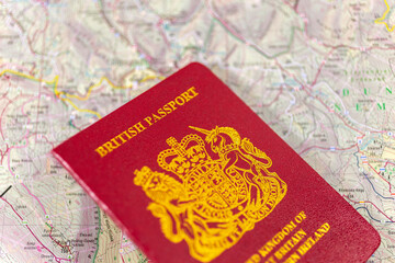 British passport on a paper map.