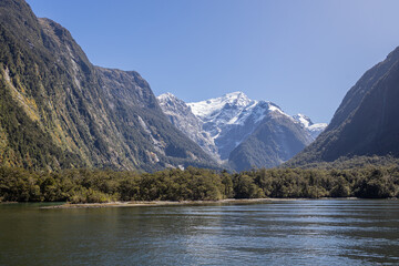 snowy mountain in the background of mild ford sound