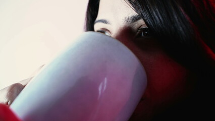 Thoughtful Woman Enjoying Hot Tea, Pensive Gaze in Cold Weather Close-Up