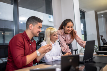 Office colleagues having discussion during meeting in conference room. Group of men and women in modern office.