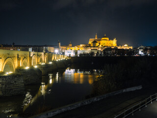 Cordoba, Spain. Roman bridge and mosque - cathedral over the Guadalquivir river. night photography