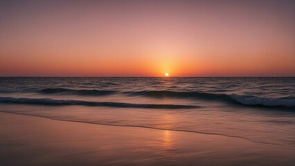 sunset at the beach A relaxing and calm sea view with open ocean water and sunset sky. The water is blue and clear,  