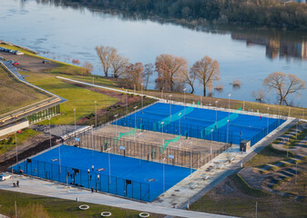 Public basketball court and tennis courts. Tops down aerial view photo with players in it in Kaunas, Lithuania