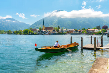 A summer day on Lake Tegernsee, Bavaria. Wooden boat at the pier