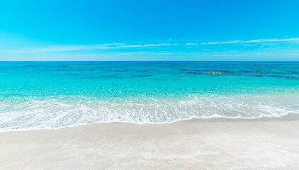 Turquoise water and white sand in a beach on a sunny day - 744155625