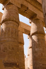 Close look at painted and curved ancient egyptian columns at Karnak temple in Luxor, Egypt