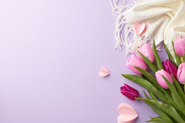 Springtime serenity: a delicate dance of florals and fabric. Top view shot of pink tulips, white...