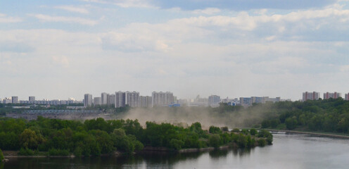 Kolomenskoye Nature Reserve Park. Panoramic view of the Moskva River from above. A misty summer landscape.