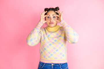 Young beautiful woman wearing casual sweater over isolated yellow background Trying to open eyes...