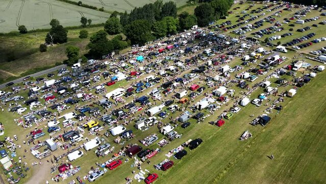 Aerial Video Of People Moving Around At A Car-Boot In Fitzwilliam, West Yorkshire, England Uk and car park for customers, footage taken in summer time