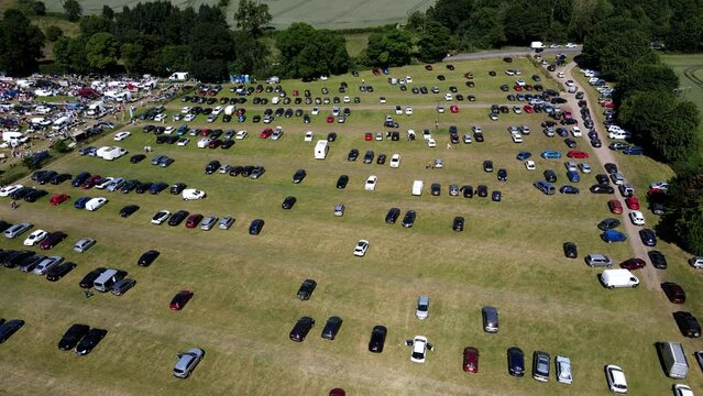Aerial Video Of People Moving Around At A Car-Boot In Fitzwilliam, West Yorkshire, England Uk and car park for customers, footage taken in summer time