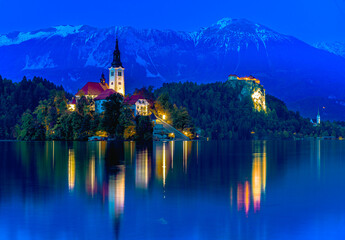 Bled, Slovenia. Sunset view of Bled Lake, island and church with Julian Alps in background - 744195491