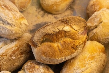 Fresh bread rolls on display in the bakery