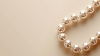 Obraz premium String of pearls on cream surface