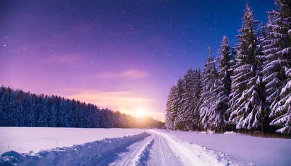 Küchenrückwand glas motiv winter night landscape forest trees and road covered snow winterly evening with first stars purple landscape with sunset happy new year and christmas concept © Toby