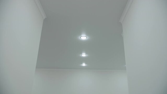 Recessed lamps in the stretch ceiling