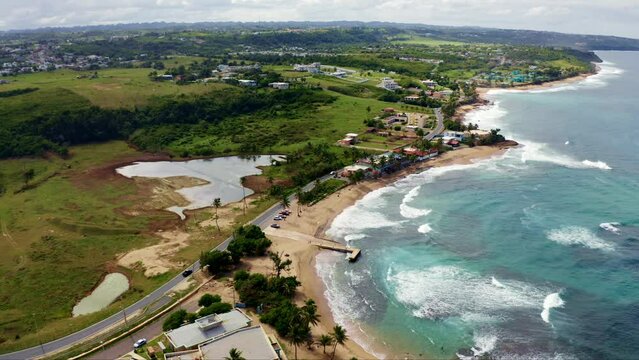 Aerial view over Penon Amador Beach on a sunny day in Camuy, Puerto Rico
