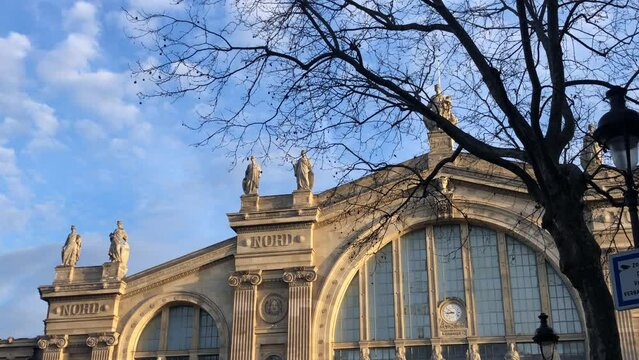 Profile view of Gare du Nord in Paris, France under clear sky.