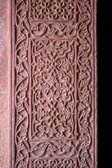 Agra, Uttar Pradesh / India - February 7, 2012 : A beautifully carved wall at the Birbal's palace in the courtyard of the Jodhabai's palace in Fatehpur Sikri, Agra.