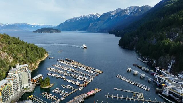 Passenger Ferry Arriving At The Terminal On Horseshoe Bay In West Vancouver, BC, Canada. aerial shot