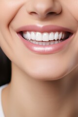 Fototapeta premium Smiling Woman's Mouth Closeup with Perfect White Teeth and Lipstick.