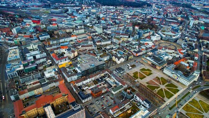 Aerial around the downtown of the city Kassel in Germany on a cloudy day in winter	