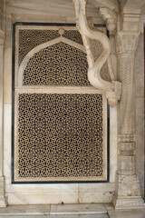 Agra, Uttar Pradesh / India - February 7, 2012 : White marble serpentine brackets of the tomb of...