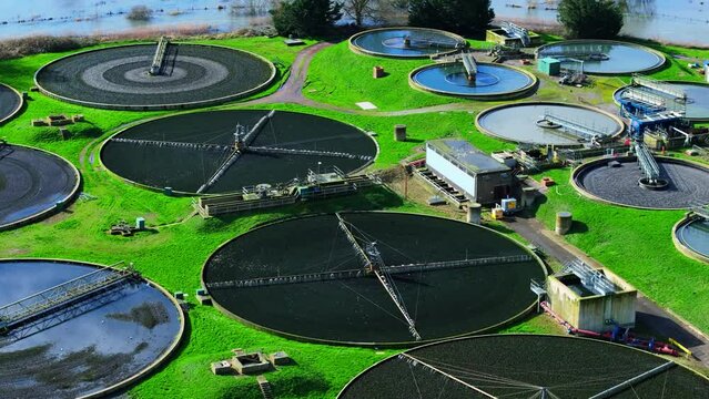 Medium telephoto aerial shot of sewerage treatment plant near Salisbury, UK