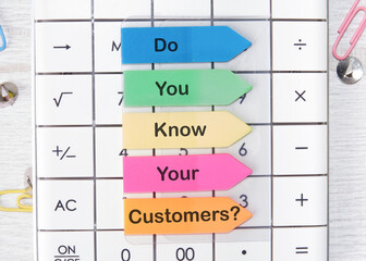 Do You Know Your Customer text on arrow-shaped stickers