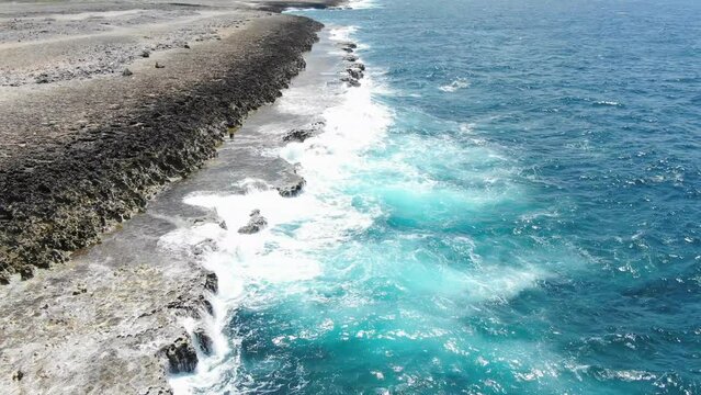 Rugged coastline in shete boka national park, curacao, with waves crashing, aerial view