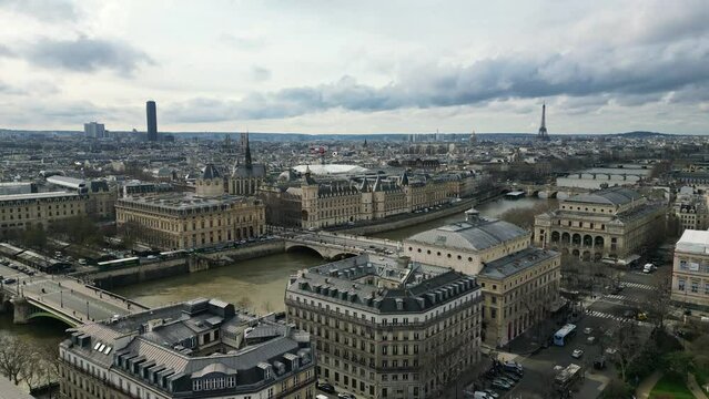 Paris seen from l'&icirc;le de la Cit&eacute; with tour Eiffel and Montparnass tower in background, France. Aerial backward