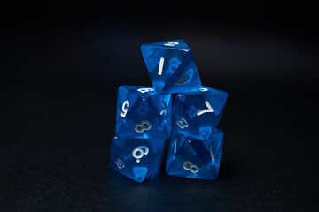 Stacked Blue Dice on Black Background: Gaming Setup