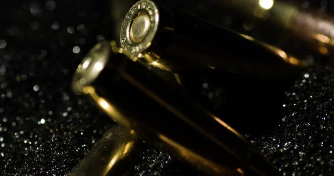 .300 AAC Blackout falling on gunpowder dust pile, circle pan, slow motion