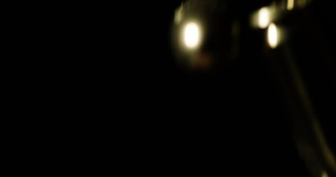 9mm Luger Cartridges Dropping Against Black Background. slow motion shot