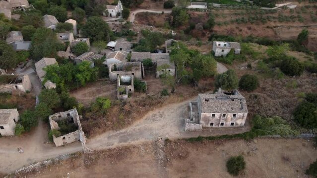 Orbit View over Old Perithia Village Abandoned Ruins Houses, Corfu, Greece