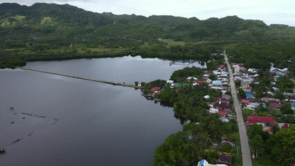 Panoramic Village in Philippines Anda coastal Lake Houses Resorts and Skyline with Cloudy Weather Southeast Asia